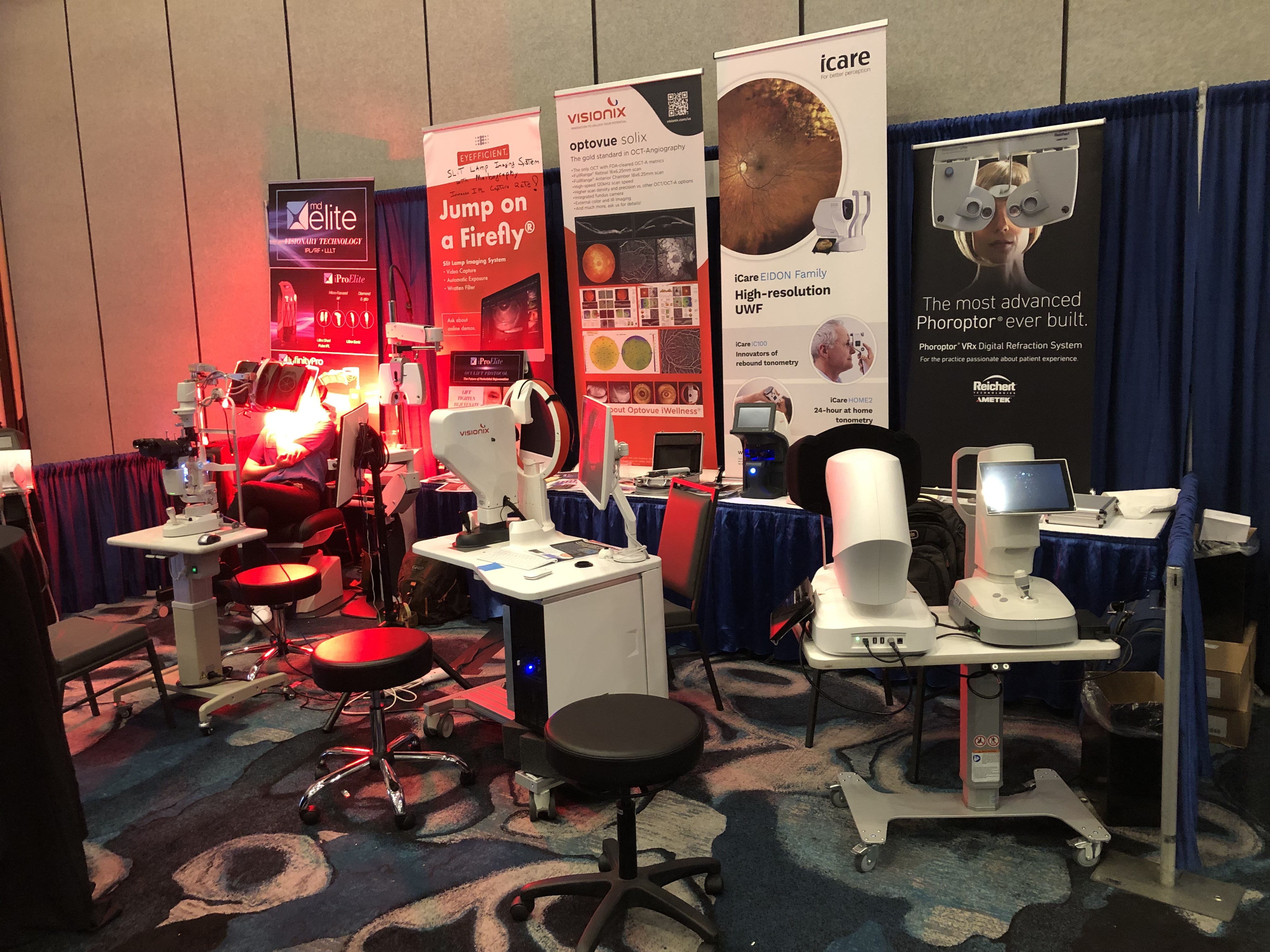 Carolina Optics equipment display at an ophthalmic trade show